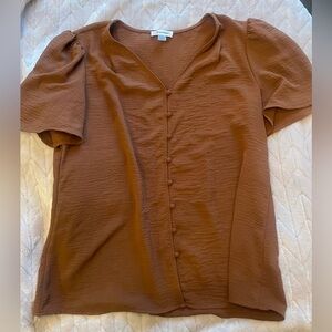 Women’s Calvin Klein rust colored short sleeved blouse w/ wrapped button detail